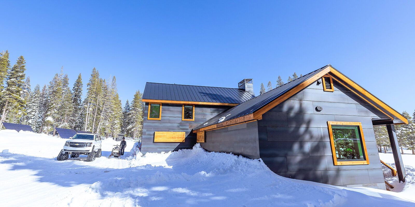 home exterior in snow with snow coach