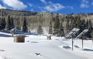 snow mountain meadow in montrose colorado with two solar arrays