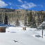 snow mountain meadow in montrose colorado with two solar arrays